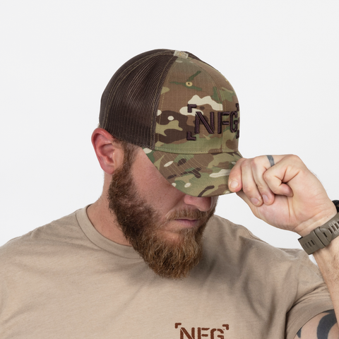 man wearing 3D Embroidered Logo Snapback – Multicam/Coyote Brown with nfg logo on front