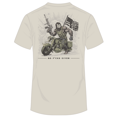 Rear view of sand tee with graphic of gorilla on motorcycle holding rifle and with American flag with text below "NO F*CKS GIVEN"